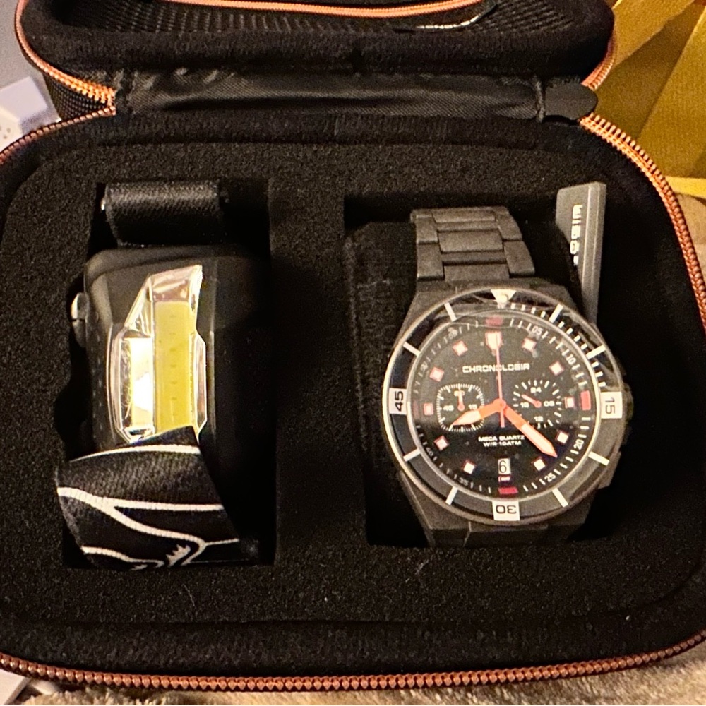 Men’s Black and Orange Watch with Case and headlamp.